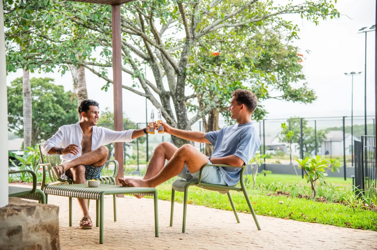 Residents relaxing together beside the Lalela clubhouse