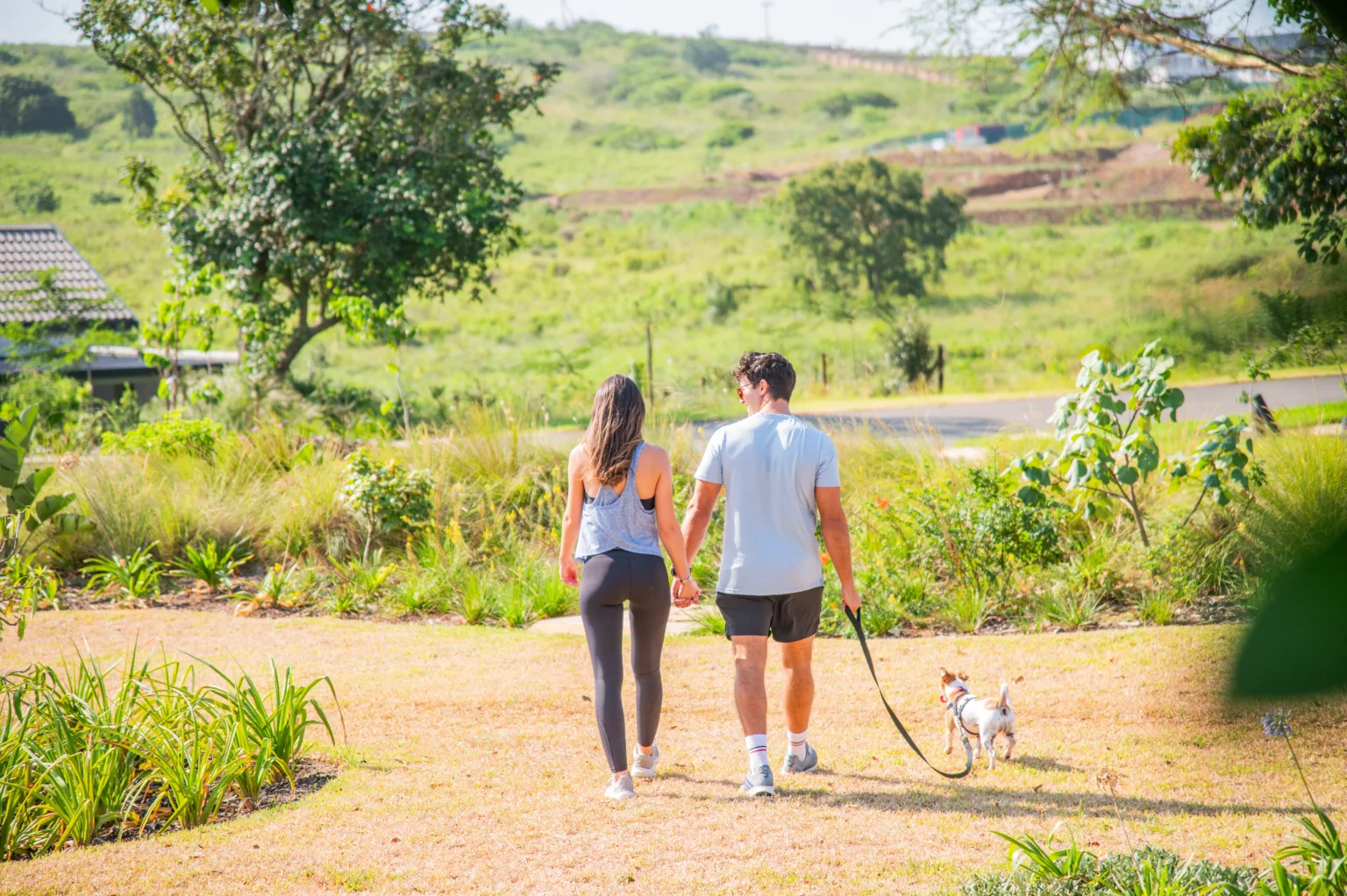Residents walking their dog through Lalela Estate