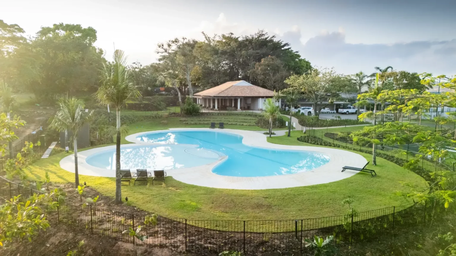 Aerial view of Lalela Estate's resort-style pool and clubhouse