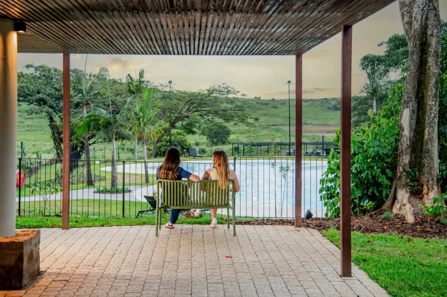 Residents overlooking the Lalela pool from the clubhouse garden